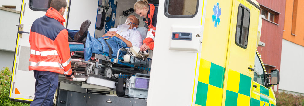 Person getting loaded into an ambulance, when should you hire a workman's comp attorney